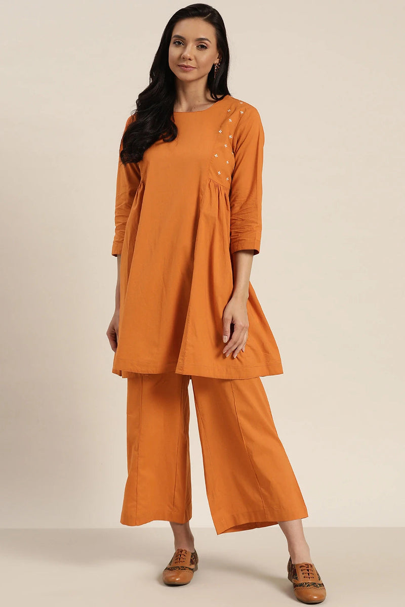 Front view rust cotton kurta set women
